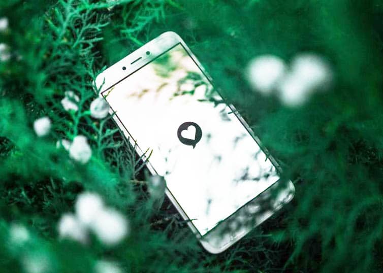 A photo of a smartphone showing a heart icon